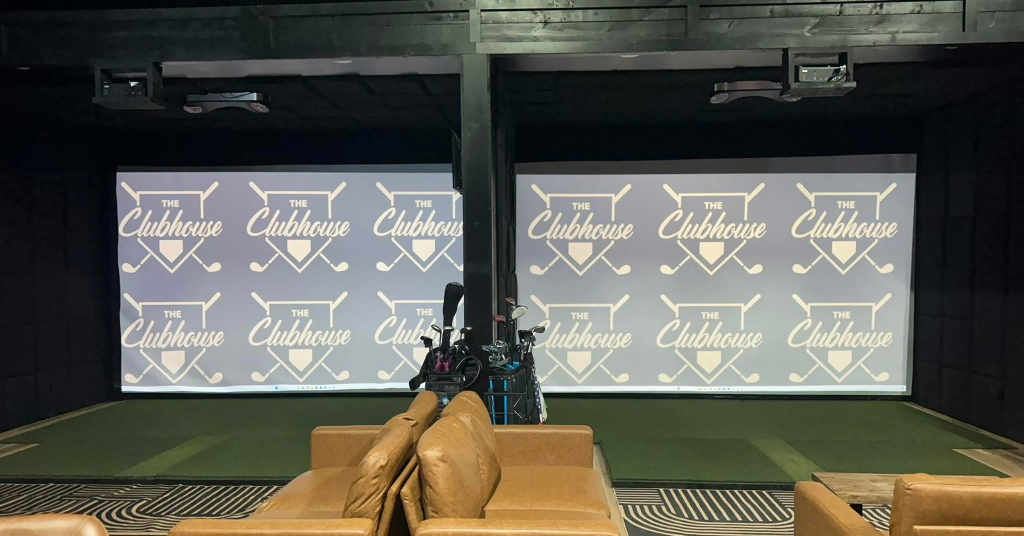 Golf simulator bay with player